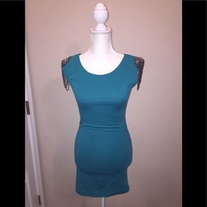 Beautiful dress with intricate shoulder detail.